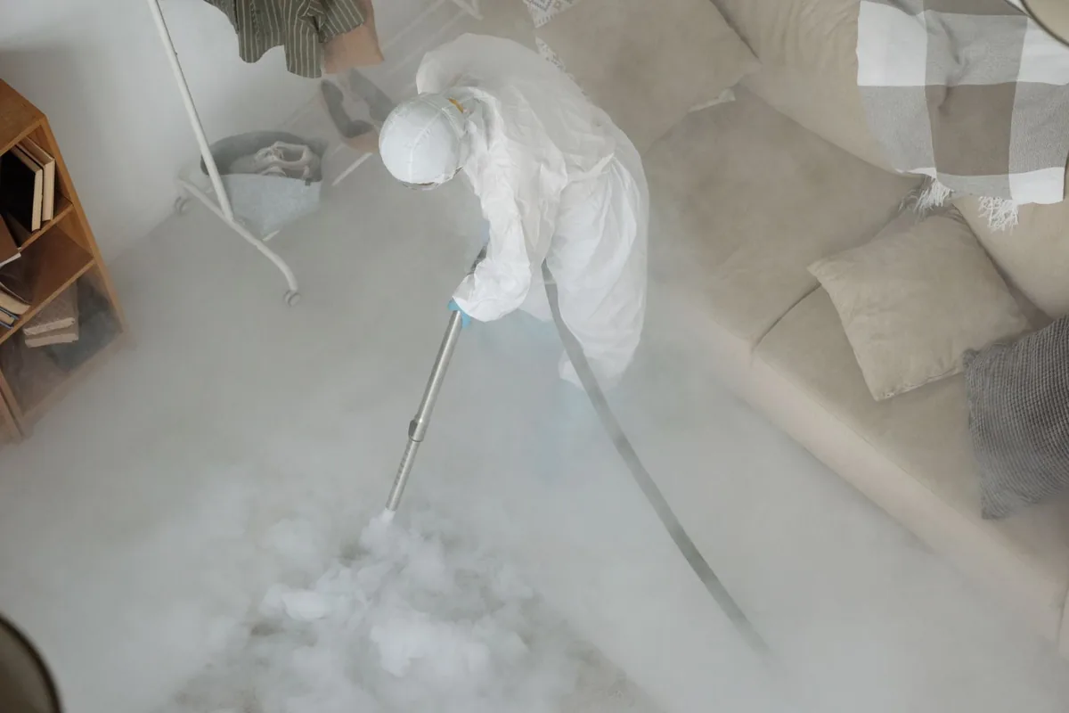 Biohazard cleanup technician in protective equipment, Salix, PA